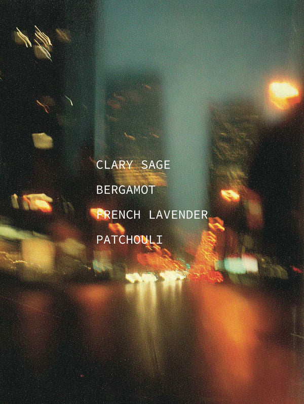 Blurred city street at night with text overlay of scents.