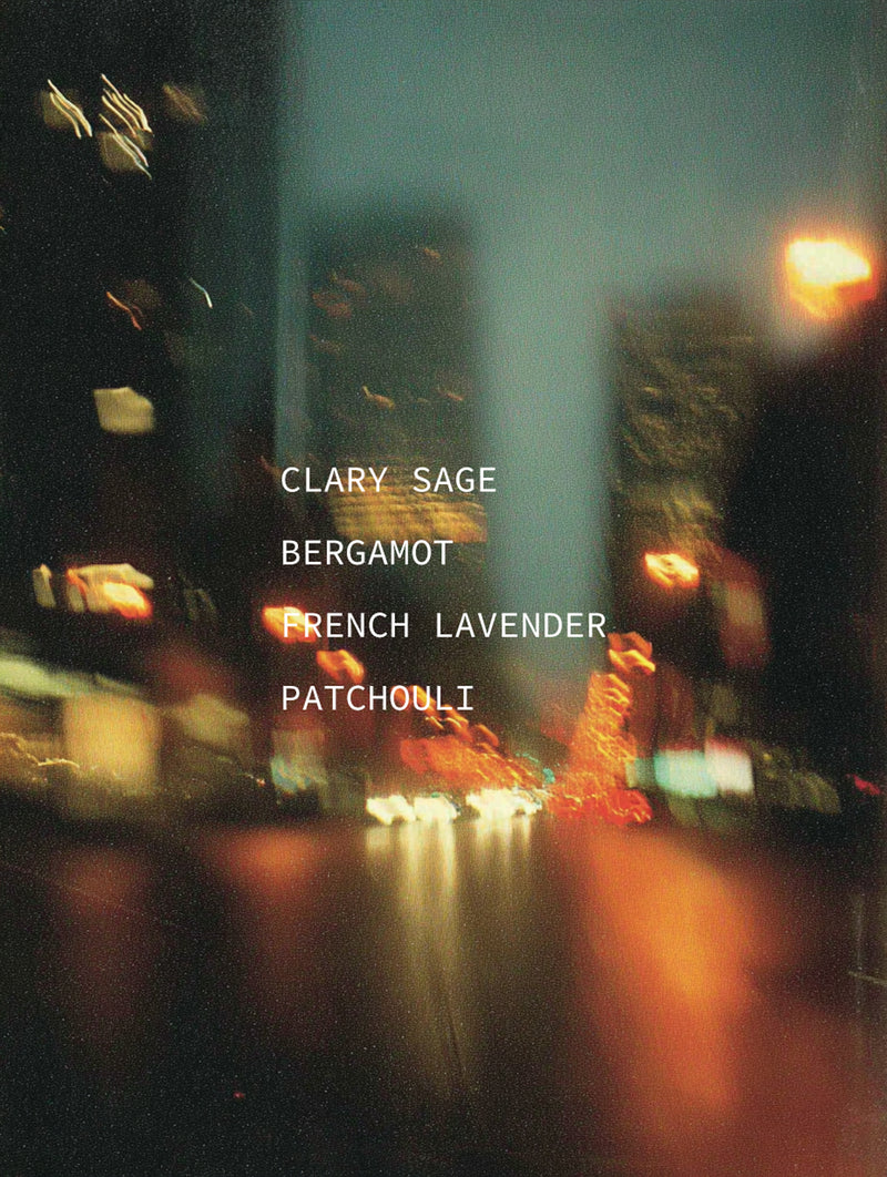 Blurred city street at night with text overlay of scents.