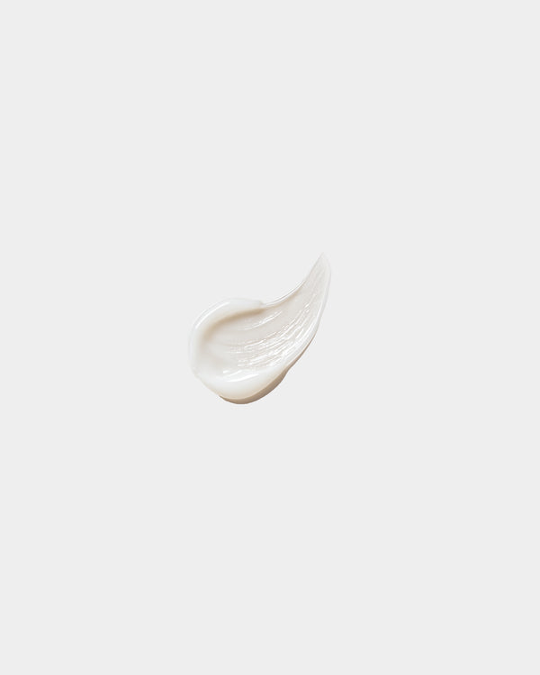 Renewal Face Serum formula swatch — white cream-to-serum texture smear on white surface