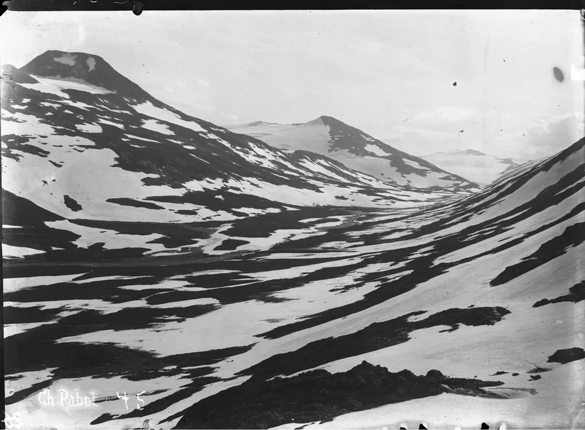 Vintage black-and-white photograph by Charles Rabot of snow-covered mountain valley with rocky Arctic peaks — archival landscape editorial for 2 Note Journal